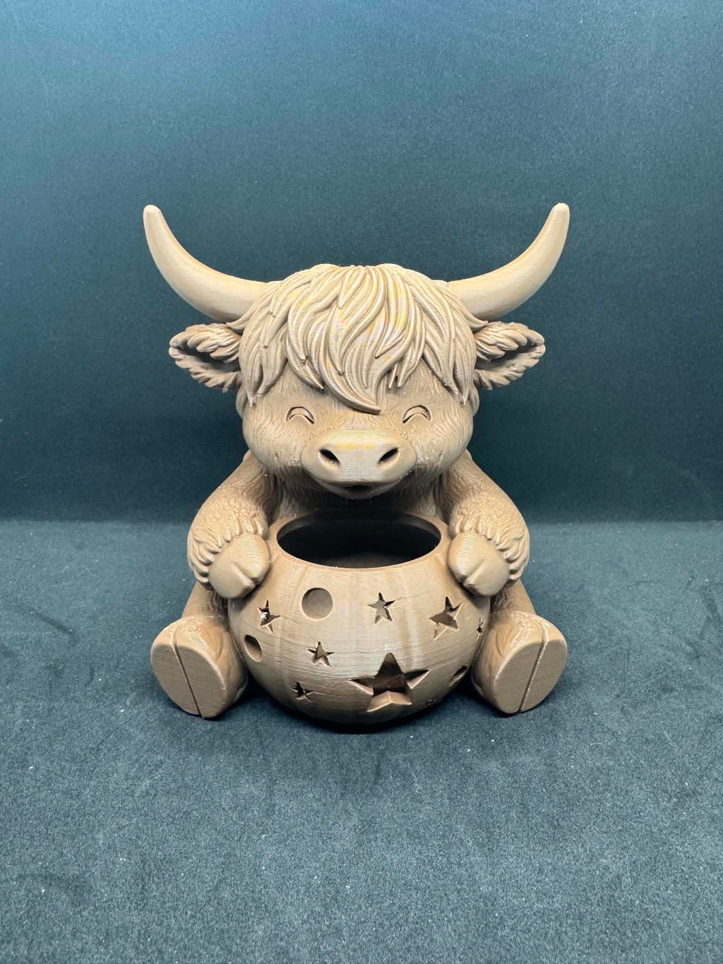 Highland cow with pumpkin
