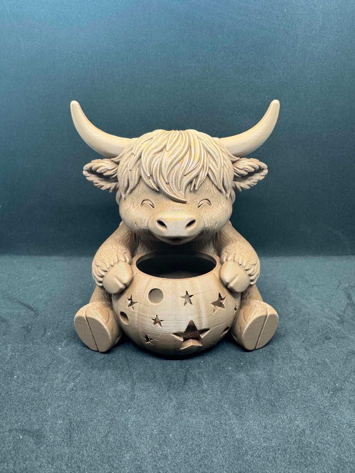 Highland cow with pumpkin