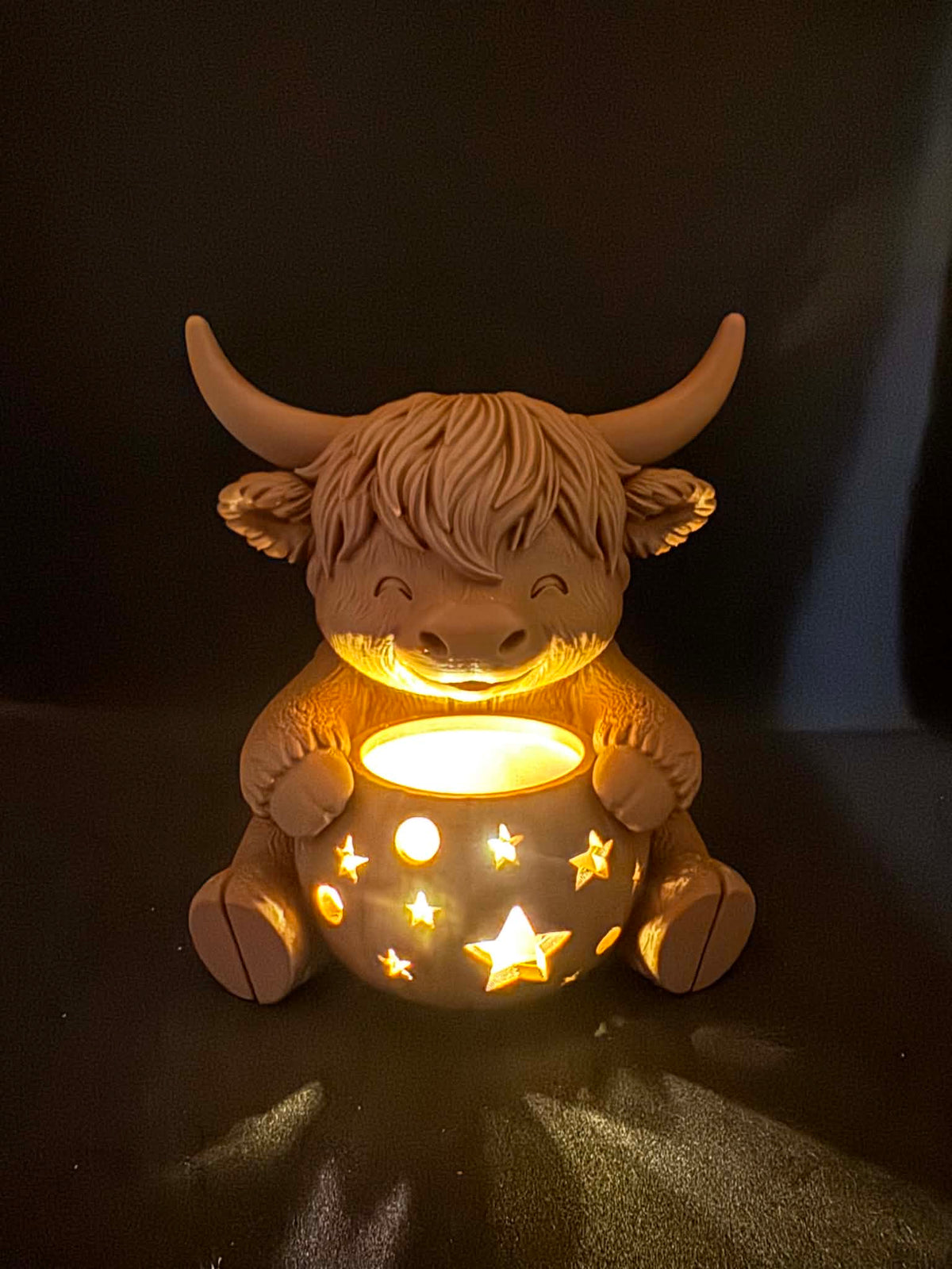 Highland cow with pumpkin